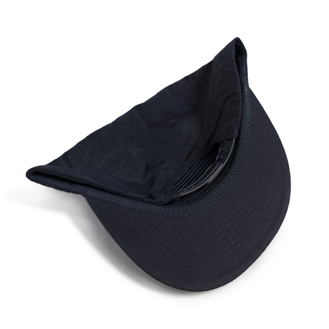 Navy Evolution Lid: your waterproof snapback that lasts.